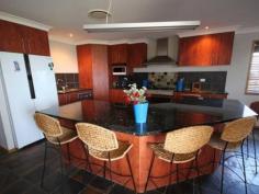  1 Farrier Dr Tanby QLD 4703 $585,000 HOME ON 1 ACRE WITH A SHED Situated at Tanby Heights is this 4 bedroom home.  Tanby Heights estate has 1 acre blocks and has sewerage to every block. You will be approximately half way between Yeppoon and Emu Park and it will only be a short drive to the harbour to launch your boat.  The lifestyle will be great when you move into this home.The block is fenced to keep the kids and the pets safe and there is a 2 bay shed for the man of the family. There is plenty of room to add a pool and have swings and a sandpit for the kids to play.This home has ducted reverse cycle air-conditioning to keep you cool in summer and for those few cool days in winter you can have comfort as well. The living area is open plan with a large kitchen with a breakfast bar with plenty of room for all the family to sit. There is a separate living area for you to watch your own TV shows. The master bedroom has an ample sized walk-in robe and an ensuite with a shower and a separate bath. All the bedrooms have built-ins and all will accommodate a queen size bed. The family bathroom has a separate shower and bath and there is a powder room off the toilet.  This home features beautiful slate floors in the living areas and timber floors in the bedrooms. Step outside to the undercover patio - this is where the family will spend many hours relaxing and watching the world go by.Arrange your private inspection today. This home has a rural outlook and yet is so close to town.   Property Snapshot  Property Type: House Land Area: 1 acres Features: Ensuite Air Conditioning Air Conditioning Family Room Fenced Back Yard Powder Room 
