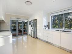  5 Kath Pl Kings Langley NSW 2147 $920,000 - $990,000 Absolutely Breathtaking Experience OPEN SATURDAY 11.00-11.30AM Simply stunning single level masterpiece offering multiple living and entertaining options. From the moment you step into the formal entry you will feel the ambiance oozing from the fully and completely renovated interior. Boasting formal lounge, separate formal dining room, then stepping down to the oversized rumpus room or games room.  Impress your guests with the ultimate chef's kitchen, offering the latest in stainless steel appliances, glass splashbacks, granite bench tops and soft close draws, which opens out via multi stack doors on to the spectacular 80 square meter covered entertaining area complete with down lights, ceiling fans and built in BBQ structure for outdoor cooking.  All bedrooms are of grand proportions with built in robes, an amazing bathroom which could hold it's place in Vogue magazine, boasting dual showers, free standing bath and separate toilet.  Extras include breathtaking highly polished genuine timber flooring, porcelain tiles, ducted air conditioning, alarm system, down lights with finger touch controls and ceiling fans in bedrooms. Added is the convenience of internal access from the garage. A truly once in a life time masterpiece, a magnificent family residence situated in the heart of Kings Langley, backing on to beautiful lush tree lined Golden Drove park, and only a short stroll to the Kings Langley shopping centre and Kings Langley public school. All set on a huge picturesque 729 sqm block, this front to back renovated home deserves all the accolades and is highly worthy of your inspection !!   Property Snapshot  Property Type: House Land Area: 729 m2 