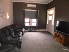  379 The Terrace Port Pirie SA 5540 $239,000  RETURN VERANDAH VILLA! This Solid Return Verandah Villa is beautifully located on a large corner allotment opposite parklands and set amongst other blue ribbon homes. The spacious home provides 3 huge bedrooms, modern tiled, 2 way bathroom with shower, bath, vanity and toilet. The kitchen is new and provides a top of the range stainless steel cooker that any chef would be proud of, breakfast bar and good cupboard space. There is a separate formal tiled dining room and a spacious lounge room complete with timber fireplace surround and reverse cycle split system air-conditioning for all year round comfort. Other features include high ceilings, quality carpets and floor coverings, extra wide hallway with arch, tiled laundry with built-ins plus much more. Externally, the home has a bull-nose verandah to the front, dual access, quality colourbond garage with power, concrete floor, kitchen and electronic rollerdoor. With a few finishing touches and minor detail to be completed, it will make this residence shine! PROPERTY DETAILS $239,000  ID: 367725 Land Area: 1104 m² Zoning: Residential 