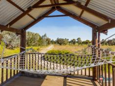  156 Randell Rd Mardella WA 6125 $600 Per Week PEACEFUL 10 ACRES This brick & colorbond 3 bedroom 1 bathroom loft style family home offers the perfect opportunity to enjoy the rural lifestyle. Tucked away at the end of a long driveway this property is situated on a beautiful 10 acres, is fully fenced and lined with trees allowing you to have the privacy you have always dreamed of. Featuring; â?¢ 	 Spacious master bedroom with walk in robe â?¢ 	 Two generously sized secondary bedrooms both with built in robes â?¢ 	 Well-appointed family bathroom offering large vanity & shower recess â?¢ 	 Large loft area that opens up onto the verandah, perfect for a fourth bedroom or office â?¢ 	 Spacious open plan living area incorporating the kitchen, dining & family rooms with reverse cycle split system air conditioning â?¢ 	 Galley style kitchen boasting stainless steel appliances, built in pantry & double fridge recess â?¢ 	 Beautiful rustic patio entertaining area with views of the peaceful paddocks â?¢ 	 Undercover parking in the double carport â?¢ 	 120,000 litre water tank â?¢ 	 Eco max waste system â?¢ 	 Bore water â?¢ 	 Solar hot water system PROPERTY DETAILS $600 Per Week ID: 372497 Available: 11/07/16  Pets Allowed: Yes 