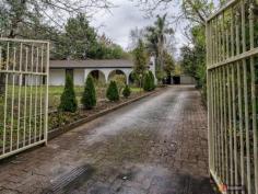  11 Tregarthen Rd Summertown SA 5141 $490,000 - $540,00 GRAB A PAINT BRUSH OPEN INSPECTION SUNDAY 3RD JULY 11.30AM - 12.00PM A stunning home in its day, this property was built to a high standard with a beautiful garden to compliment it. The bones of this home and garden remain and offer the new owner a wonderful opportunity to restore the property to its former glory with updates along the way. As is, the solid brick home presents with a very live able three bedrooms, two of which have built in robes. Raked ceilings in the formal living and dining room give the feeling of space and light and are kept comfortable in the winter months by a gas (bottle) heater. The large kitchen and family room offer an abundance of bench space and have an updated stove, cooktop and stainless steel splash back. This area also contains a cast iron slow combustion heater which can heat most of the house when up and going.  Although original the bathroom and laundry are large in size and perfect for the growing family. A large paved and covered area leads directly off the family room offering protection from the winter weather and a wonderful west facing summer alfresco dining option. There is ample water storage in the form of a concrete tank which is backed up with a bore (non metered) allowing the maintenance of a garden even in the driest of periods. A four car garage and single carport (high access) along with extra wood sheds and chicken run just add to the features of this property. Set a short stroll from a bus stop with direct city access the property is a 15 minute drive to Burnside or ten minute drive to Stirling.  It would be a pleasure to show this property for those looking to update a family home to its former glory. Please contact Mark Burns on 0404151804 or at mburns.blackwood@ljh.com.au for inspection times or further details.   Property Snapshot  Property Type: House Land Area: 2,400 m2 Features: Outdoor Entertaining Fully Fenced Workshop Dishwasher 