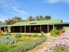  230 Honeyeater Glade Chidlow WA 6556 $549,000 HOME SWEET HOME ON 5 ACRES Escape the hustle and bustle of city living in this lovely, well presented three bedroom, north facing, country homestead built in 1999 by Ross Squire Homes which sits together with a triple carport & storage atop a fenced and paddocked 5 acres adjoining reserve and situated in a quiet cul de sac with a lovely valley aspect. FEATURES • 	 Well presented 3 bedroom country homestead • 	 Built 1999 by Ross Squire Homes • 	 All bedrooms with BIRs • 	 Spacious open plan living with high raked ceilings • 	 Large lounge with atrium • 	 Master suite with air conditioning • 	 Verandahs front & rear plus patio • 	 Triple carport with storage area • 	 Garden shed & chicken enclosure • 	 Water tanks & colorful gardens • 	 Cleared & fenced 5 acre (approx.) block • 	 Suit horses, alpacas, etc • 	 Close to beautiful Lake Leschenaultia • 	 Easy commute to Mundaring, Midland & airport Enter through the front door and be captivated by how light and bright the home is. An atrium makes a lovely feature separating the two living areas of the home. Both its large lounge and spacious open plan living area having tiled floors and high raked ceilings with exposed beams whilst the practical kitchen offers a lovey view through its large picture window. The bedrooms are carpeted, all have built-in robes and the master suite has air conditioning. Verandahs front and rear add to the character of the home whilst the patio adds further functionality. A triple carport with a storage area is conveniently located at one end of the home. Other improvements include water tanks, chicken enclosure and garden shed. Would be suitable for horses, alpacas and the like. Be quick for this one. Other features: Built-In Wardrobes Property Details Elders Property ID: 8541545 3 bedrooms 1 bathrooms 3 car parks 3 car carport Air Conditioning 