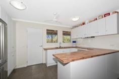  136 Mocatto Rd Acacia Hills NT 0822 $659,000 PERFECT THE WAY IT IS This property is perfect the way it is and only 2 years young. Quiet and tranquil in its bushland setting, this elevated home is sleek and modern with a great lifestyle aspect to it. Be enchanted by the relaxed abode and bask in the solidarity of living rural.  The property itself is nestled on 20 acres of land that is securely fenced with dog proof fencing and natural bush plus there is a large fenced yard around the home. The home is elevated up above the tree line and enjoys bushland views from the front and rear balconies. Sitting here you can entertain or unwind and enjoy the absolute peace and quiet. The rear deck has a built-in bar from which you can look down over the fire pit below or out over the paddocks. Inside the home has tiled flooring with an open plan central living, dining and kitchen area that are all light and airy. The kitchen is sleek and modern with a country chic feel. Wrap around counters in a bamboo look finish add in a homely touch to the white on white cabinetry.  The master bedroom has glass french doors that opens onto the balcony plus enjoy an ensuite and his and hers walk-in wardrobes. Two more bedrooms reside on this level and each is complete with built-in wardrobes and air conditioning. Downstairs is an additional forth bedroom with a bathroom and the laundry amenities.  Under the home is an expansive entertaining area with a 6-seater spa and a BBQ area that looks out over small manicured gardens with the fire pit area at the rear. Parking cars and boats is not a problem, you can fit 2 or more under the home. Included in the sale is a 40 foot sea container, a gun safe, the above mentioned spa plus a 25,000L water tank. There is a strong bore on the property as well.  Close to Humpty Doo, Noonamah and Berry Springs amenities plus approximately 30 minutes to Palmerston CBD. Neat and tidy, this home requires no improvements - it is perfect the way it is. Property Details Elders Property ID: 10173938 4 bedrooms 3 bathrooms 2 car parks Land Area 2 hectares Double carport 