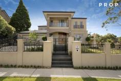  1 Brazilia Drive, Glen Waverley, VIC 3150 Luxury School Zone Living, Walk To Glen Waverley Shopping Centre This consummate Glen Waverley property, only 2 years young, was born of the desire to create a lifestyle residence befitting astute modern families accustomed to fine living and unparalleled craftsmanship. An elegant edifice of Georgian character set in a prominent position, defines this home with enviable curb appeal. The open yet well-defined floor plan is ideally laid out. Plenty of personal spaces are available for all members of your large or extended family, with 5 outstanding bedrooms (4 on upper level), upstairs retreat and an elegant lower level study. All five bedrooms enjoy the privileges of private ensuite baths and walk-in-robe. Master bedroom epitomising decadence with premier finishes, vast amounts of space and a private balcony. The elegant designer kitchen was also designed with large families in mind, not to mention the love of entertaining! In addition to its fully outfitted servery, it boasts an additional butler’s kitchen with access to the full equipped laundry – all complete with stone benchtops, sleek stainless steel appliances and high gloss black and white cabinetry, impressing the most capable of home chefs! With a plethora of outstanding features inclusive of ducted heating/refrigerated cooling, ducted vacuum, secure alarm system, expansive driveway leads to a 2-car garage with additional vehicle space. With a premier location, just moments’ walk to Mountain View Primary School and within easy reach of renowned Glen Waverley Secondary College, Wesley College, Caulfield Grammar, The Glen Shopping Centre, stunning parklands and an easy commute to the Melbourne CBD – feel the pulse of this outstanding neighbourhood and enjoy an unrivalled lifestyle. 