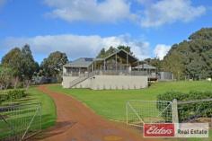  15 Manton Way Willyung WA 6330 The Perfect Property ELDERS EASY AUCTION - SATURDAY 27TH AUGUST AT 11AM - UNLESS SOLD PRIOR • Carefully designed and crafted home in quiet cul-de-sac. • Quality fittings and fixtures to home; double glazed windows & ducted vacuum. • The ‘Queenslander’ styled home offers an unobstructed tree view. • 4 large queen size bedrooms plus large office. • The home provides spacious living areas with french doors on to deck. • Wide verandahs and deck create the perfect setting for entertaining. • Easy access to the home from the large rear garage into house. • 2 Rainwater tanks offering 70,000L capacity run water into house, scheme water available. • 4,379sqm of land, easy vehicle access to shed at rear. • Shed measures 144sqm and includes a large mezzanine for extra storage. • Separate 1 bedroom self-contained accommodation in shed at rear. • Covered parking for 6+ vehicles, plus room for a caravan/boat. If you are looking for the perfect family home with room for everyone inside and out, look no further!  If you are looking for a quality built home with room for the family when they come to stay, a good size shed and room for the caravan, look no further! Very seldom does a property like this become available so soon after construction that it presents like new. This home and property is the result of careful planning and diligent attention to care, it is a true credit to the current owners. Even the most discerning of buyers will find the home an absolute pleasure to visit. Set aside plenty of time to inspect 15 Manton Way because there is a lot to take in, features like; o High quality double glazed windows and doors throughout the entire home. o The home is fully insulated! With insulation under the floor, external and internal walls and 2 layers of insulation to the roof cavity. o A huge main living area with beautiful raking ceilings opens on to the deck and the view beyond. o Quality kitchen with sold surface bench-tops, well designed and carefully crafted cabinetry.  o Premium appliances to kitchen; freestanding Falcon Cooker and noiseless integrated rangehood. o Ducted vacuum system with dustpan extraction unit to kitchen. o Large bathrooms with spa to ensuite and full height tiling. o Timber floors throughout the home. o Queen size bedrooms plus large study/5th bedroom. o 1 bedroom , self-contained flat to shed. Great for guests or teenage retreat. o Low maintenance decking to all verandahs and screening. o Solar panels to shed & Apricus Solar Hot Water Heater with 340L tank. This property is an absolute must see and will go to auction on Saturday 27th August at 11:00am – If not sold prior.  Come to the next open home of contact Brendon Nowotny on 0432 998 035 for a private viewing at any time. Other features: Built-In Wardrobes,Garden,Secure Parking,Polished Timber Floor,Terrace/Balcony, fully insulated Property Details Elders Property ID: 10085147 5 bedrooms 3 bathrooms 4 car parks Land Area 4379 square metres Double garage Double carport Air Conditioning 