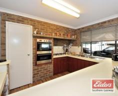  31 Currie St Warnbro WA 6169 $375,000 SPACE? YOU GOT IT!!! OWNER SAYS 'GET THIS SOLD!'BRING ME YOUR BEST OFFER.ALL OFFERS PRESENTED  This designer Summit home has only had one family owner. Well maintained over the years, but now it’s time to move on and let another growing family enjoy. Easy stroll to beautiful Warnbro and Waikiki beaches. * Four double bedrooms, all with robes. * Main bedroom is spacious, has walk in robe, built in dressing table and sliding door to outside. * Ensuite, with garden window and roman bath.  * Study next to main bedroom, could double as a nursery or 5th bedroom. * Double door entry into hall area with attractive feature planter. * Formal dining area. * Step down to good sized lounge with carpet.  * Open plan kitchen, family, dining area with wood vinyl slats flooring. * Kitchen is well appointed and has gas hot plate, pantry and plenty of bench space.  * Laundry and separate toilet. * Family bathroom. * Step down separate games room with built in bar. * Gabled expansive patio with loads of brick paving. * Grassed backyard with plenty of space for all your toys. This lovely family home has an abundance of additional features: Gas bayonets, gas hot water, security screens, linen cupboard, ceiling fans, double security front door and a serious amount of feature jarrah.  Close to schools shops and transport and situated in lovely ‘old’ Warnbro. Call to view, this one won’t last. Property Details Elders Property ID: 10394298 4 bedrooms 2 bathrooms 1 car parks Land Area 901 square metres Single carport 