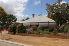  41 Butcher St Bruce Rock WA 6418 $160,000 CIRCA 1945 COUNTRY COTTAGE HOME This well presented country cottage home sits on a large quarter acre (1012m2) block in a good area. Only a 5 minute walk to main street shops and same to Bruce Rock Primary School and Bruce Rock Hospital. Great first time investor or home-buyer opportunity and well suited to the down-sizer or tree-changer moving from the city. Concrete driveway to double length carport parking. Paved front veranda and shade awnings. Spacious hall entry with polished timber boards. 2 large front bedrooms with A/C plus 2 rear sleep-out rooms. Formal lounge with c/fans and french doors to carport. Eat in kitchen with electric cooking, ample storage space and reverse cycle split A/C. Bathroom is tiled with shower, vanity and W/C. Full length rear sun-room exit and internal laundry with workers shower and second toilet. 80L Rheem electric HWS. Concrete rear porch overlooks yard with lawn, fruit trees and rainwater tank. Older iron garage shed and two garden sheds.  All inquiries to exclusive selling agent Elders Real Estate. Phone Will Morris 0448 415 537. Other features: Close to Schools,Close to Shops,Garden,Secure Parking,Formal Lounge Property Details Elders Property ID: 10363977 2 bedrooms 1 bathrooms 2 car parks Land Area 1012 square metres Double carport Air Conditioning 