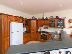  3 Bon Street Lobethal SA 5241 $479,000-$495,000 Smitten By Style... Property ID: 10492714 Living is easy in this impressive, generously proportioned contemporary residence with a beautiful outlook over the landscaped gardens, and charming creek setting. A wonderful offering, master built nestled on a large 1455sqm level block in a desirably tranquil cul-de-sac location. Solid, stylish and with high ceilings the builder has created timeless appeal which will reflect the personality and taste of those accustomed to the best in quality design, finishes and lifestyle. The Federation style brick home encompasses four spacious bedrooms with plenty of room for study, sleep and storage, two luxurious bathrooms, and a well appointed, open plan kitchen and living area that flows through to the private rear patio. The spacious master bedroom, complete with walk-in robe and ensuite, ensures parents have a private space at the western end of the home. The entrance hallway immediately reveals a theme of quality, with federation style floor tiling, ornate cornicing and ornate ceiling rose. The hallway also offers a quality timber front door with inlaid leadlight windows. The formal lounge room offers carpet and feature glass double access doors. There is also an inbuilt gas log fire place with gorgeous decorative porcelain tile component. An ornate timber fire surround also highlights this quality fixture. Elaborate cornicing is also present in the formal lounge room and is further enhanced by the high ceilings throughout the home.  The open plan family living area looks out over the beautiful garden and grounds. The kitchen offers ample cupboard and bench space, corner pantry and there is a brand new self cleaning electric oven. Looking out onto the living area , the room is light and bright via the use of glass sliding doors and the outside entertaining area has been covered with suntuff roofing to further enhance and promote good light flow.  The established garden, presents an open grassed area with a mix of European tree’s including Gladitsia, Camelia’s, Liquid Amber, Manchurian Pear, Weeping Wisteria, bulbs and many more shrubs and flowering plants. There is a beautiful creek setting also flowing through the southern end of the property, complete with charming footbridge over the creek. There is a double car garage with fixed cupboards and pull down stair access to the upstairs, fully lined loft area with light and power, which could lend itself to a become a teenage retreat.  Perfect for a family, this home is ideally positioned and retains the value of peaceful living while being conveniently close to shops, school and transport. Land Area 	 1,455.0 sqm 