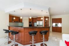  9 Barrow Ct Mount Barker SA 5251 $745,000 The art of living fabulously! Property ID: 10516195 Elevated at the end of an inviting cul-de-sac on a generous 2369sqm allotment this property exudes style and elegance and will have you thoroughly impressed! The huge home offers five well proportioned bedrooms, three generous living areas, high ceilings and high end finishes!  The 12 panel solar system is driven by a ‘solar river’ inverter and there is a separate solar system to heat the in ground salt chlorinated pool.  The home offers style and character with brick quoin work, 2.7 metre high ceilings, high gable roof and front verandah and steel framework. The intelligent floor plan with three distinct living zones provides flexibility for harmony and peaceful living. All of the flooring offers diamond style tiling, together with ornate diamond style inserts at the front door entrance and the bedrooms are carpeted. The formal dining and lounge are also connected via a servery to the huge kitchen / family area. This family living area also offers a Mitsubishi split system.  The kitchen is well appointed with central island bench, glass splash backs, double sink, Miele dishwasher. Omega range hood, gas stove top and separate wall mounted oven and microwave. Cupboard space is generous, including wall mounted glass fronted display cupboards and a walk in pantry. This north facing living area is light and bright with floor to ceiling windows and electric operated blinds.  There are five bedrooms (one of which is currently used as an office) the other bedrooms offer two door floor to ceiling robes. The master bedroom is of excellent proportion with two feature hexagon design windows. The ensuite is also very spacious with separate toilet, corner spa, three door, three drawer vanity and a sizable shower alcove.  The main bathroom offers a powder room with two door linen press, three door, three drawer vanity, the toilet is separate and there is a separate bath / shower area.  The laundry has its own outside access and the hallway leads to the two car garage under the main roof with automated roller doors and there is also a roller door at the rear for vehicle access to the backyard. At the rear of the home is a 5m x 5m hip roof undercover entertaining area, complete with high end cafe blinds, notably there is also extensive brick paving, landscape walling and storm water provisioning.  A high gable 15m x 10m three sided shed / together with a 6m x 2.5m extension, protects the inbuilt concrete fully tiled in-ground swimming pool, which is heated and salt chlorinated. Next to this complex is a separate 9m x 6m high gable lockable shed, with light and power and roller doors at both ends, this enabling a drive through to the rear grounds. The backyard beyond the pool offers a wonderful open space plus a Lemon, Apricot, Apple and Cheery tree, all of which are at a mature fruit bearing age.  The front garden and lawns offer a fully automated watering system. Rain water from a 5000 gallon 20,000 litre tank and pressure pump is used for virtually 9 months of the year, given the extensive roof catchment from all of the buildings. All in all, a well planned, highly developed property on an inviting street with lovely views in the impressive, desirable, Waterford Estate. There are plenty of Community parks and gardens and now with the added significant Bald Hills overpass / underpass which provides residents easy access onto the freeway (thus saving about 10 minutes), to either Adelaide or Murray Bridge. Building / Floor Area 	 527 sqm Land Area 	 2,369.0 sqm 