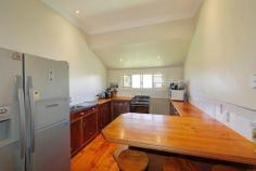  50 Water St Walkervale QLD 4670 $259,000 Feels Like Home! Make It Yours! This gorgeous lowset home has been given the touch of love. All the hard work done, now this happy home is ready for new owner/s to add their special touch! A typical Queenslander, with its modern twist - high ceilings, magnificent polished timber floors. Three large bedrooms, the main air conditioned a large kitchen with ample storage. The lounge and dining area open out onto a very spacious covered deck, big enough to entertain several families. You are further spoilt with the option of a second living or huge office space. A 771sqm allotment is fully fenced and is child and pet friendly. Nestled in Walkervale, this home offers convenience to shops, school and general proximity to CBD. Presenting low maintenance yard and gardens, double car accommodation and workshop plus a lawn locker, to top the package off the home also has solar power. Lowset Queenslander with modern features. 3 bedrooms, 2 built-in, main a/c. 1 Bathroom, separate toilet. Second living/large office space. Polished timber floors. 2.7m high ceiling line. Fully security screened. Huge covered timber deck. Additional covered outdoor space. 2 Car garage/ workshop plus lawn locker. Fully fenced 771 sqm block. 3.4 kw solar electricity system. Insulated ceiling Don't miss out, this happy home is ready for new owner/s, call Exclusive listing agent Rob Prendergast, 0412 511 220. Inspection is a must! Property Features Land Size : 771 m2 