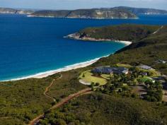  1320 Nanarup Road, Albany WA 6330 MAITRAYA: A World Class Private Estate and Business Description  Overlooking Nanarup Beach and the Southern Ocean, Maitraya is situated 20 minutes from Albany in the Great Southern region of Western Australia. Maitraya, 'Place of Loving Kindness', is a sanctuary spanning 550 acres of pristine land, which offers privacy, functionality and abundant natural beauty. In addition to being a magnificent home, Maitraya is run as a prosperous private retreat ideal for weddings and functions, with accommodation for up to 60 guests across the main house, Fisherman's Lodge, Aviator's Cottage and Country Chalets. Maitraya's main house boasts spectacular views of the ocean from all rooms, in all seasons, and is supremely comfortable in all weather; the central atrium provides an impressive tropical garden and the ability to naturally regulate the home's temperature, and the pool, spa and sauna are used year round. The eight double bedrooms each have en suites and walk-in-robes, and both kitchens are fully equipped and spacious. The living spaces include formal lounge, theatre, superbly fitted dining room, conference and living rooms. Maitraya's leisure opportunities include a tennis court, children's indoor play ground, and a lake which is ideal for kayaking as well as being bountiful with marron. Nanarup and Salmon beaches, including a private tranquil lagoon, are accessed in under five minutes via private walking trails, which also provide access to artworks and birdwatching. The property is securely gated and can be accessed by motor vehicle or directly by aircraft, using Maitraya's private airstrip and helipad. Maitraya is an exquisite, unique and multi-faceted property, combining world class luxury living, a thriving venue for corporate functions and weddings, and livestock revenue. Note: Maitraya is to be sold 'as a going concern' with confirmed and future bookings for weddings, events and functions. Read more  Features  Bedrooms : 16 Bathrooms : 14 Below Ground Pool : 1 Carport : 12 Water Closets <%=featureName %> View more features  Summary Type : House Size : 2246000 sqm   