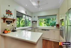  24 Hardwick St Stratford QLD 4870 $600,000's Enjoy The Serenity Of Stratford!!! Don't miss the Opportunity! Motivated Vendo Situated in the highly sought after suburb of Stratford is this beautiful four bedroom character home. Not only does it offer functional living it will win over your heart with its charm, superb finishes and seclusion.  Catering for the most discerning buyer this home offers impeccable finishes throughout. From the stone kitchen benchtops to the absolutely stunning timber floorboards there is something to capture your eye around every corner.  Set on a private 1050sqm of land with only one neighbour you are treated to a separate studio or teenagers escape and beautiful in ground swimming pool, both of which overlook the magnificent open space of the Jalarra Parklands.  At A Glance: - Four generously sized, air-conditioned bedrooms with the master suite offering a walk through robe, ensuite and private balcony. - A generous family bathroom with large plunge bath. - Separate powder room downstairs.  - A well-appointed kitchen which includes stone benchtops, stainless steel appliances and overlooks the outdoor entertainment area and parklands. - Open planned dining and lounge with separate studio overlooking Jalarra Park.  - Outdoor entertaining timber deck. - Beautiful in ground swimming pool surrounded by natural rainforest. - Double carport. - 1050sqm of land - Built 1996 I encourage you to inspect this beautiful home. Please call me to arrange a time that suits you.   Property Snapshot  Property Type: House Land Area: 1,050 m2 Features: Ensuite Air Conditioning Built-In-Robes Close to Schools Close to Shops Close to Transport Pool 