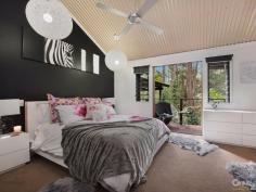  9 Native Bird Pl Buderim QLD 4556 $889,000  Bali At Home, Tranquil Resort Style Living Revitalise your inner spirit and peace in this resort style home located on the acreage foothills of Buderim. Sprawling over natural rainforest behind remote gates, this stunning pavilion style residence is interlocked by a defined entrance, encapsulated by running water features that leads into the outdoor living room deck. From here, you can relax and enjoy the sounds of nature, overlooking your own private pool and rainforest. A charming Pot Belly Stove ensures warm comfort for those cooler months.  This home has dual accommodation to cater for a growing family. Features include: a raised spa with running water features through to a lagoon pool. This hidden sanctuary offers more than you could imagine and is sure to impress those who wish to holiday at home.  To the main residence there is an air-conditioned spacious open plan kitchen living/dining area, with feature high ceilings. There are ample windows and timber stacker doors that allow plenty of natural light into the home. This area is fully tiled and has a modern kitchen, with excellent appliances and island bench. Adjacent is a hallway which leads to the king size master bedroom. It has a large walk-in wardrobe and adjacent bathroom, with a bath, shower, powder room area and separate toilet. There is also a second queen size bedroom that has built-in wardrobes and ceiling fan.  Your separate guest accommodation incorporates a spacious open plan living area, with beautiful timber flooring and tiling, soaring high ceilings and a timber staircase that leads up to a bedroom loft. The centre piece of the room is an ornate open feature fire place, where you can spend winter nights relaxing. Adjacent is a well equipped kitchen area with sink, ample cupboard and bench top space, plus dishwasher. There is a separate shower room with toilet, single vanity and shower. To the outdoors off the living area you have your own private balcony that has timber flooring. Here you can sit and enjoy the tranquil rainforest views.  Leading off from the main living area is a stunning master bedroom which has a huge separate walk-in wardrobe. It has its own private en-suite with a double shower, plus single vanity and toilet. The master bedroom has its own private timber deck, which leads out to the swimming pool.  To the outdoors in the main entrance area, is the enormous Balinese style undercover outdoor living deck, which is large enough to host the largest of occasions and family gatherings, in your own private surroundings. This truly unique home has far too many features to list. Only an inspection will do it justice.  - Four Bedrooms, Plus Study, Plus Loft, Plus Craft Room  - Gated Approx 2,002m² Acreage Allotment, In Cul-de-sac Location  - Approx 421m² Home  Main Residence Features:  - King Size Master Bedroom With Spacious Walk-In Robe & Ceiling Fan  - Queen-Size Bedroom With Built-In Wardrobe & Ceiling Fan  - Bathroom, Single Vanity, Bath, Shower & Separate Toilet  - Air-Conditioned Spacious Tiled Kitchen Dining/Living  - Soaring High Ceilings  - Kitchen With 900m Free Standing Oven & Range Hood  - Ample Cupboard & Bench Top Space, Plus Bosch Dishwasher  - Large Separate Multi-purpose Room Underneath Main Residence  Guest House Features:  - Master Bedroom With Private Balcony & Timber Decks  - Large En-Suite With Shower, Single Vanity & Toilet  - Spacious Separate Walk-In Wardrobe  - Spacious Open Plan Living Area & Feature Fire Place  - Kitchen, Ample Cupboard & Bench Top Space, Sink & Dishwasher  - Polished Timber Floors & Tiling, Timber Staircase To Bedroom Loft  - Separate Shower Room, Single Vanity, Shower & Toilet  - Large Separate Walk-in Storage Room With Shelving  Outdoor Features:  - Stunning Water Feature To Main Entrance  - Undercover Balinese Outdoor Living Area Overlooking Pool Area  - Surrounded By Stunning Private Rainforest Back Drop  - Extensive Outdoor Timber Decking & Timber Doors  - Lagoon Style Pool With Spa & Cascading Waterfall Feature  - Large Undercover Area For Caravan/Boat Or Work/Shop  - Spectacular Rainforest Views From All Rooms  - Private Lush Gardens With Lots Of Birdlife & Fauna  - Larger Than Average Separate Double Remote Garage  This is a rare opportunity to purchase an executive dual accommodation residence. Only an inspection can do this property justice.  PROPERTY DETAILS $889,000  ID: 385224 Land Area: 2002 m² Building Area: 421 