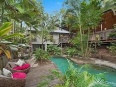  9 Native Bird Pl Buderim QLD 4556 $889,000  Bali At Home, Tranquil Resort Style Living Revitalise your inner spirit and peace in this resort style home located on the acreage foothills of Buderim. Sprawling over natural rainforest behind remote gates, this stunning pavilion style residence is interlocked by a defined entrance, encapsulated by running water features that leads into the outdoor living room deck. From here, you can relax and enjoy the sounds of nature, overlooking your own private pool and rainforest. A charming Pot Belly Stove ensures warm comfort for those cooler months.  This home has dual accommodation to cater for a growing family. Features include: a raised spa with running water features through to a lagoon pool. This hidden sanctuary offers more than you could imagine and is sure to impress those who wish to holiday at home.  To the main residence there is an air-conditioned spacious open plan kitchen living/dining area, with feature high ceilings. There are ample windows and timber stacker doors that allow plenty of natural light into the home. This area is fully tiled and has a modern kitchen, with excellent appliances and island bench. Adjacent is a hallway which leads to the king size master bedroom. It has a large walk-in wardrobe and adjacent bathroom, with a bath, shower, powder room area and separate toilet. There is also a second queen size bedroom that has built-in wardrobes and ceiling fan.  Your separate guest accommodation incorporates a spacious open plan living area, with beautiful timber flooring and tiling, soaring high ceilings and a timber staircase that leads up to a bedroom loft. The centre piece of the room is an ornate open feature fire place, where you can spend winter nights relaxing. Adjacent is a well equipped kitchen area with sink, ample cupboard and bench top space, plus dishwasher. There is a separate shower room with toilet, single vanity and shower. To the outdoors off the living area you have your own private balcony that has timber flooring. Here you can sit and enjoy the tranquil rainforest views.  Leading off from the main living area is a stunning master bedroom which has a huge separate walk-in wardrobe. It has its own private en-suite with a double shower, plus single vanity and toilet. The master bedroom has its own private timber deck, which leads out to the swimming pool.  To the outdoors in the main entrance area, is the enormous Balinese style undercover outdoor living deck, which is large enough to host the largest of occasions and family gatherings, in your own private surroundings. This truly unique home has far too many features to list. Only an inspection will do it justice.  - Four Bedrooms, Plus Study, Plus Loft, Plus Craft Room  - Gated Approx 2,002m² Acreage Allotment, In Cul-de-sac Location  - Approx 421m² Home  Main Residence Features:  - King Size Master Bedroom With Spacious Walk-In Robe & Ceiling Fan  - Queen-Size Bedroom With Built-In Wardrobe & Ceiling Fan  - Bathroom, Single Vanity, Bath, Shower & Separate Toilet  - Air-Conditioned Spacious Tiled Kitchen Dining/Living  - Soaring High Ceilings  - Kitchen With 900m Free Standing Oven & Range Hood  - Ample Cupboard & Bench Top Space, Plus Bosch Dishwasher  - Large Separate Multi-purpose Room Underneath Main Residence  Guest House Features:  - Master Bedroom With Private Balcony & Timber Decks  - Large En-Suite With Shower, Single Vanity & Toilet  - Spacious Separate Walk-In Wardrobe  - Spacious Open Plan Living Area & Feature Fire Place  - Kitchen, Ample Cupboard & Bench Top Space, Sink & Dishwasher  - Polished Timber Floors & Tiling, Timber Staircase To Bedroom Loft  - Separate Shower Room, Single Vanity, Shower & Toilet  - Large Separate Walk-in Storage Room With Shelving  Outdoor Features:  - Stunning Water Feature To Main Entrance  - Undercover Balinese Outdoor Living Area Overlooking Pool Area  - Surrounded By Stunning Private Rainforest Back Drop  - Extensive Outdoor Timber Decking & Timber Doors  - Lagoon Style Pool With Spa & Cascading Waterfall Feature  - Large Undercover Area For Caravan/Boat Or Work/Shop  - Spectacular Rainforest Views From All Rooms  - Private Lush Gardens With Lots Of Birdlife & Fauna  - Larger Than Average Separate Double Remote Garage  This is a rare opportunity to purchase an executive dual accommodation residence. Only an inspection can do this property justice.  PROPERTY DETAILS $889,000  ID: 385224 Land Area: 2002 m² Building Area: 421 