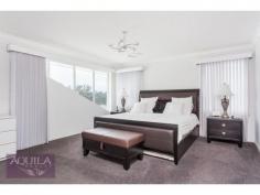  7 Convallis Vista, The Vines WA 6069 Resort Lifestyle full with Quality, Pool and Golf Views Location and packed with features makes this superb two storey family home hard to beat. No expense spared with Intelligent Homes smart wiring, and high specs throughout, this quality built home has a flowing floor plan with second storey master wing and enclosed theatre. Queen size bedrooms downstairs with bedroom 2 having direct bathroom access. A generous sized study allows for a home based business or optional fourth bedroom. Ready for summer!  With zoned reverse cycle air conditioning and below ground fibreglass pool. The oversized alfresco area is complimented by a huge Beefeater kitchen system which is included. Need extra parking options? The expanded side area has loads of potential for parking a boat, caravan, trailer etc. The rare location offers a native bush backdrop with local kangaroos frequently passing by.  A short walk to the private Vines Resort with all the restaurants and amenities that it has to offer. PREMIUM HIGHLIGHTS Over 300sqm 2 Storey quality home LG reverse cycle ducted air conditioning with zoning Intelligent Homes smart wiring TV and Data points throughout Valet ducted vacuum system Quality finishes throughout 600 X 600 Porcelain tiling through out Plantation shutters throughout living area Panel doors with skirting throughout Neutral themes and Devore throughout Barrier Reef Fibreglass pool Quality appliances throughout Extra tinting on selected windows Side access for potential storage for trailers, boats etc Solar Hot Water system with gas instantaneous option 2 Zone Kolcom camera intercom with access upstairs and downstairs   
