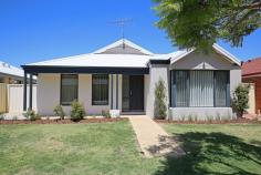  33 Guillardon Terrace Madora Bay WA 6210 $399,000 EXCEPTIONAL VALUE IN MADORA BAY This exceptional valued 3 bedroom, 2 bathroom home proudly displays immaculate presentation and is privately set on a low maintenance 442sqm block in very sought after Madora Bay. Only a few minutes to the beach, new Mandurah surf club, parks, Meadow Springs Shopping Centre and golf course.  Once you step inside, you will love the stylish decor with stunning vinyl plank floor coverings and immaculate presentation. The spacious living includes a separate front lounge room and a large open plan family, meals and kitchen area which showcases amazing extra high curved crescent ceilings which give a wonderful architectural feel.  The lovely galley kitchen is great for cooking up a storm, with stainless steel appliances, lots of storage space and a large breakfast bar. Entertain all your friends and family in style under the north facing alfresco which is protected from the elements and has a high vaulted ceilings. The low maintenance established gardens have automatic retic and there is a double lock up carport at the rear along with potential access for small boats or caravans. This value packed beachside home is not to be missed.. So call Michael O'Brien on 0419 192 895 to book in a viewing. 