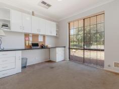  19 Kurrajong Rd Safety Bay WA 6169 $300,000's CHARMING HOME AND A HUGE BACKYARD! Positioned on a large 704sqm block in Safety Bay, this property would be perfect for anyone wanting a huge back yard that is ready for a pool or workshop, or for someone who is just looking for a wide open space to enjoy with the family.  The property offers a good size lounge which enjoys a front yard outlook and flows through to the separate dining area which has been cleverly redesigned into a study nook with built in desk and shelving. The spacious living area occupying the centre of the home is overlooked by the open plan kitchen that offers additional access through to the front of the home. Complete with good bench space, gas stove and rangehood, the kitchen enjoys views out to the patio and is ideally located for entertaining visiting guests. Each of the bedrooms are located to the rear of the property and are serviced by the updated bathroom that has been modernised with glass screen shower and chic vanity. Outside, the patio provides a great entertaining space that overlooks the rear yard which is complete with raised garden beds, two sheds and a huge lawn which is ideal for adding a swimming pool or workshop. Located at the rear of the single garage is a good size brick workshop or storeroom, perfect for a man cave or just storing additional belongings from your new home.  Other features include: - 	 Ducted reverse cycle A/C - 	 Potential drive through side access  - 	 Automatic bore reticulation  With everything that the Safety Bay area offers, you'll have the benefit of schools, parks, beaches and shopping all just a few minutes away - you could not ask for a better location or property! Contact David Parlor on 0412 734 727 for a private viewing. 