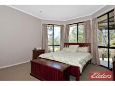  9 Turpentine Dr Cedar Vale QLD 4285 $479,000 Country Charm with this Family Home This is a lovely family home, the 9’ceilings give this home a spacious and airy feeling, and there is plenty of room for the family to spread out.  In true “Coral Home” style there is two living areas: the formal lounge with detailed cut out walls and the second one is the fully tiled open plan kitchen, dining and family room (comes with air-conditioner), this room is adjacent to the outdoor entertainment area which will make family functions a pleasure.  The main bedroom is large and comes with a walk-through robe and ensuite and its located away from the other 3 bedrooms – all 3 bedrooms come with built in robes and ceiling fans.  The home comes with a double integral garage and the added bonus is another big shed (11m x 6m) with power and a small shed on the side, there is also the cost saving 5Kva Solar power system. The backyard is very private and comes with a unique Rustic Theme Gazebo, chicken pen and plenty of room for a vege patch, this section of the backyard is fully fenced but there is more land beyond so if you are ever wanting a pony or a couple of sheep there is plenty of room for another paddock.  The Rustic Theme has been repeated at the front of the home with an outback fence and dry creek bed with deck, it’s been beautifully done and is a striking feature of this lovely home.  Set on a 1 acre block and located in the great Cedar Vale lifestyle estate, this home is just waiting for you, there is school bus pick up in the area too. Property Details Elders Property ID: 10680104 4 bedrooms 2 bathrooms 4 car parks Land Area 4141 square metres 4 car garage 