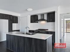  9 Honeysuckle Court Jimboomba QLD 4280 $433,000 Stylish Home, Prime Position A rare opportunity to enjoy an elevated position at the top of this small and select cul de sac of just 10 homes, within walking distance of the local parks and schools, in this attractive and very progressive location. A home of distinction awaits your inspection, from that stylish rendered / rock façade on through the practical no nonsense floor plan and out to the back yard beyond, on this fully serviced 900 sqm block, I think you’ll find a bright and comfortable home, with a range of attractive features. The carpeted formal lounge or media room, enjoys views to the front of the property, and offers a room that’s perfectly proportioned with the added benefit of those stylish yet practical window shutters.  The fully tiled family and dining room again offers a balance between style and functionality, with stacker patio doors (and security screens) gliding back to give uninterrupted access to the al fresco dining area, which has been incorporated under the main house roof, while the reverse cycle air conditioner will ensure your comfort throughout the year. A substantial 5 burner gas cooking range, with electric oven awaits your inspection, complimented perfectly with abundant caesarstone bench tops with extensive high and low line cupboards, offering plenty of storage space in this attractive kitchen area. Caesarstone extends to both bathrooms, with a twin vanity unit and oversize shower featuring in the en-suite (with separate toilet closet) of this very spacious master bedroom, which also boasts an equally spacious walk-in robe. Double built-ins, then should come as no surprise in each of the other three bedrooms. Cupboard space too is good news, with double linen in the hall plus a separate broom cupboard and then another linen cupboard in the laundry as well. And as you will have seen in our images, there is the obligatory double lockup with internal access, in this case with a timber style door in keeping with timber front door which contracts exceptionally well with the rendered façade. The kid and pet friendly back yard is fully fenced, with plenty of level yard for everyone to enjoy, which has been thoughtfully separated from the garden area by that substantial sandstone retaining wall. So if you have been looking for a suitably stylish yet practical place to call home, enjoying a prime and elevated position here in a quiet cul de sac, within easy reach of an array of facilities, then an early inspection is highly recommended. Property Details Elders Property ID: 10609775 4 bedrooms 2 bathrooms 2 car parks Land Area 900 square metres Double garage 