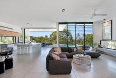  7 Elanda St Sunshine Beach QLD 4567 $3.2M Architectural Masterpiece When architect Tim Ditchfield designed this majestic residence sitting high on the sand dunes above Duke Street, he created a flowing space that took advantage of not just it's highly fancied NE aspect, but its tree top views across to the Pacific Ocean.  Sitting on an impressive parcel of land, approximately 50% larger than traditional Sunshine Beach blocks, this architectural masterpiece, offers the perfect balance of contemporary design and beach luxe. At approx. 670sqm, the residence was built using a pallet of contemporary building materials, yet softened with beautiful timber accents and architectural lines drawn from Californian architecture of the 50s and 60s.  With a focus on bringing the outdoors in, the heart of the home is both an impressive indoor space and idyllic outdoor escape. The substantial Corian breakfast bar is both minimalistic and warm whilst matches perfectly with the Italian stone bench tops under which Italian appliances fit without fanfare.  Flowing outdoor behind 3meter high sliding doors that hide as well as hang off the side of the home, the outdoor kitchen is home to a commercial teppanyaki grill, top of the line Electrolux BBQ and gas burner as well as an industrial double glass door bar fridge. The timber deck has aged beautifully to further soften this delightful space, yet is complimented by almost invisible frameless glass. The pool is both a key feature at night as well as a great day time tree top experience as you look over Sunshine Beach and onto The Pacific.  With flexibility a key factor in the design, the home will meet the needs of those looking for either a 3, 4 or 5 bedroom home. The top level of the property is breathtaking, with open plan kitchen, butlers pantry and living area as well as both outdoor and indoor dining options. This level also features a study nook with 3 separate workspaces and a powder room. The lower level features the bedrooms as well as a huge rumpus room, substantial home-office, laundry, I.T room and an under-pool wine cellar and storage area. The entrance with its 3 meter high bright green pivot door and indoor outdoor fish pond, also has an oversized double garage as well as separate pool room/gym/man land.  Whilst every room in the house is air-conditioned as well as heated, the current owner has never used the air conditioner in the main living area (due the beautiful summer sea breezes) and typically enjoys the open fire when the breezes turn westerly in the winter months.  Elanda Street is a quiet street with impressive homes and is ideally situated just a short stroll from the shops, restaurants and bars of the Sunshine Beach Village, as well as the hugely popular Surf Club and patrolled beach. With the magnificent Noosa National Park and its multitude of walks as well as coves and beaches close by and Noosa Junction and Noosa Heads just over the hill, the location is simply perfect.  If you are looking for the ultimate family home that oozes style as well as practicality or a luxe low maintenance beach house then 7 Elanda Street is the perfect solution. PROPERTY DETAILS Offers over $3.2M ID: 395194 