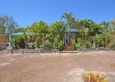  32 Swan Dr Booral QLD 4655 $335,000 A HOME AMONGST THE GUM TREES Sitting well back from the road on 4970m2 of fenced land you will find this unique two bedroom residence that will appeal to the buyer who likes their privacy, and space for their four legged friends. The shady full length front veranda is a great place for evening BBQ'S or just a quiet space to sit with a good book and enjoy the peace and tranquility of your surrounds. Inside, the living area & bedrooms features raked ceilings with both bedrooms having built in robes. The kitchen is modern and features a glass cook top and pantry. Separated from the main dwelling by a covered breeze way sits a double lock up Garage, presently utilized as a bar and snooker room. A new 9x6m Colorbond Shed sits at the side of the block and would be ideal to house the boat and van. This gently sloping block is dotted with shade trees and shrubs yet it still has lots of open space for the new Owner to stamp their own character on the property. You are only a short 10 minute drive from all the attractions of Hervey Bay yet far enough away to enjoy a healthy country life style. So put on the Akubra and riding boots and let's go & have a look at your new Mini Ranch. Property Features Land Size : 4970 m2 