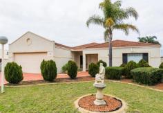  32 Fern Leaf Ct Leeming WA 6149 $699,000 What a Beauty! Open SUNDAY 1:00 - 200 PM House - Property ID: 914191 32 Fern Leaf Court Leeming welcomes you with a beautiful, manicured garden at the front, and a wide open double doors entry. As you enter, you will feel the grandeur with the inspiring window treatments, laminated timber flooring, chandeliers etc. at the formal Lounge/living area and the Dining area. The master bedroom is to your right as you enter, and it comes with a semi-ensuite, and a large walk-in-robe. The exquisite spa invites you to relax both in winter and summer! The spacious Theatre room/sunken games area is enclosed with French doors.The well-appointed kitchen is strategically located that you can serve and enjoy your delicious food at the large breakfast bench, meals area, formal dining area, or at the enclosed alfresco entertaining area outside. There 3 more rooms that comes with walk in robes. The ducted vacuuming system ensures a clean atmosphere inside, and the 6 independent reverse cycle air conditioners will do the job of floating you in cosy comfort whether it is a freezing winter or hot summer! The party goes on at the light filled, enclosed alfresco entertaining area outside - what a gaiety merriment at 32 Fern leaf Court, Leeming!  The opulent lawn is for your Prince & Princess to play. So what do you like to do? Play badminton or feel like swimming. There is enough space to put a pool if you choose to! Location is the key: stroll to the Melville Glades Golf Club, easy access to the Roe Highway, Kwinana Freeway, Murdoch Train Station, Bus stop, minutes away from the Fiona Staley Hospital, St. John of God Hospital, Murdoch University, Leeming Shopping Forum, Spud Shed, and Canning Vale Markets. The proximity to Schools is another attaraction: West Leeming Primary School on Westall Tce, Leeming Primary School on Westminster Rd, Banksia Park Park Primary School on Hicks St, and Leeming Senior High School on Aulberry Pde. Special Attractions & Features include: * North Facing  * Year of Construction: 1995 * Double Brick * Tiled Roof * High Ceilings * Elegant Formal Lounge Area * Formal Dining Area * Classic Theatre Area with French Doors * 4 Bed rooms and 2 Bath rooms * 6 R/Cycle Air Conditioners * Ducted Vacuuming System * Security Alarm System * Crimsafe security Windows & Doors * Laminate Timber Floors & Tiles in Bath rooms * Double Garage with High ceiling * Laundry * Separate W.C. * Walk in robes & built in robes * Enclosed alfresco entertaining area  * Auto Reticulated Beautiful Gardens * Set on a 695sqm block * Excellent Neighbourhood For further information on 32 Fern leaf Court, Leeming, contact Johnson George on 0422 590 187.  Features  Land Size Approx. - 695 m2  Built-In Wardrobes  Close to Schools  Close to Shops  Close to Transport  Garden 