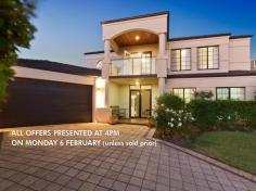  19 Deverall Square Hillarys WA 6025 $1,100,000 - $1,200,000 ALL OFFERS PRESENTED AT 4PM ON MONDAY 6 FEBRUARY (unless sold prior) Grand two storey family home set in an elevated and peaceful Hillarys location and sought after cul de sac nestled amongst other quality homes. With its spacious and luxurious living plus a stunning resort style Alfresco and pool area, this beautiful home is sure to impress! Ideally located with almost everything you need very close by including an easy walk to Whitfords shopping centre and St. Mark's Anglican School (without even needing to cross a road) also in close proximity to public transport, parks and magnificent beaches. - 	 Double front doors lead to tiled entrance extending through to the main living area - 	 Study is conveniently accessed from the foyer and has views into the tranquil front yard - 	 Formal dining or lounge (the choice is yours) off the foyer - 	 The heart of the home comprises of a light and spacious open plan kitchen, family room and meals opening out to the Alfresco for the ideal indoor outdoor lifestyle - 	 Games/theatre room is located off the main living area through double French doors and has an internal window making it easy to keep an eye on the kids! - 	 Family dinners and entertaining will be a breeze in the crisp and modern white chef's kitchen with large bench space, modern European appliances, double pantry and heaps of cupboards - 	 Three double bedrooms downstairs all with built in robes - 	 Family bathroom with dual access to the largest of the three downstairs bedrooms, ideal for guests or a lucky teenager - 	 Large laundry with fitted cupboards - 	 Upstairs parents retreat includes a lounge with access to a generous private covered balcony offering sensational sunsets and views of the Indian ocean, Rottnest and the Rottnest lighthouse in the evenings. Impressive master bedroom with a large fitted walk-in robe, attractive well-appointed ensuite with double basins and shower as well as a free-standing tub. - 	 The timber decked Alfresco and Bali hut overlook the sparkling pool - 	 Easy-care reticulated lawn and gardens - 	 Awesome cubby house for children to enjoy which includes a DVD -TV and play area underneath. - 	 Double automatic garage with direct access into the house and backyard, additional workshop/storage area plus fold away stairs into the roof space Additional features: - 	 Bright white Plantation shutters throughout giving it a Hamptons feel - 	 Ducted reverse cycle a/c downstairs plus split units in all the bedrooms and upstairs lounge - 	 10 Solar panels - 	 Ample storage including roof area with floorboards for extra storage - 	 Linen press - 	 Recently painted and fully renovated with many of the fittings still under warranty  With its combination of grandeur and practicality, situated in the heart of one of Perth's best coastal suburbs, this is a home not to be missed! 