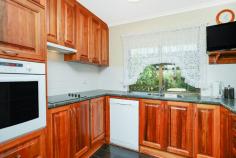  74 Canterbury Rd Victor Harbor SA 5211 $319,000-$339,000 Immaculate Central Home House - Property ID: 906408 A beautifully maintained and upgraded mid 1980's brick veneer build, well placed on the 836m2 to provide very useable rear yard. The floor plan offers a slated entrance, generous carpeted lounge with combustion heater, timber kitchen cupboards with dishwasher, wall oven and bench plates with a servery into the adjacent slated dining and family room complete with a split system reverse cycle air conditioner. There are 3 carpeted bedrooms (all with built-in robes), plus an office/den. The spacious family bathroom sparkles and offers a screened shower, bath and vanity with separate toilet. The laundry is located nearby with storage cupboards. A paved pergola adjoins the home. A detached lockup shed/workshop located in the rear yard and vehicle storage is provided by a double length drive-thru carport with roller door at the street frontage and a gravel caravan/boat site at the end.  Features  Land Size Approx. - 836 m2 