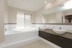  2 Filmer Pl Leeming WA 6149 $935,000 2 Filmer Place, LEEMING $935,000 FAMILY ENTERTAINER Open for Inspection:  Sat 4th Mar 1:30pm-2:15pm  Save    Creative and thoughtful design and a modern lifestyle blend to make this Leeming property feel like home. Set on a 727sqm corner block, the modern style of this 4/5 bedroom, 2 bathroom Webb and Brown-Neaves built home is instantly evident and draws you in wanting more. Upon entering the home you'll immediately be impressed by the wide entry hallway with stunning solid timber floors that extend throughout the open living. The home was well ahead of its time and has been cleverly designed into zoned living spaces, most with an outlook to the outdoor entertaining alfresco and swimming pool. The kitchen is central to the entertaining and living zones of the home so you'll always feel part of the action. It includes glass splash back, breakfast bench, a double fridge recess and modern appliances making it both attractive and functional. It is open plan to the dining area and lounge with impressive high raked ceiling creating a great feeling of space. The spacious tiled games room also has direct access to the outdoor bar and alfresco while the cosy theatre room with high raked ceiling is the perfect hideaway to watch a movie in peace.  Entertaining in this beautiful home is a delight. The timber decked alfresco and outdoor bar with stone bench top will be central to many gatherings and is all under the main roof, adding to the flowing feel of the home. The outdoor living overlooks the crystal blue swimming pool, complete with poured limestone surrounds and unobtrusive glass pool fencing. The roomy master suite features a generous walk-in robe and a timeless ensuite with large spa bath, double vanity, semi-frameless shower and separate toilet that all make this space your sanctuary. The 3 remaining bedrooms are located at the rear of the home and feature built-in robes and ceiling fans. The study or fifth bedroom is privately located at the front of the home.  The location is fantastic, only a short walk from Leeming high school and primary, the shops and cafes of Leeming Forum and parks and a short drive to Fiona Stanley hospital, Murdoch University, Bull Creek train station and freeway access. West Leeming and Bibra Lake primary school zones. It has all the extras including smart wiring, reverse-cycle air-conditioning, a double remote garage, security system, reticulation, large garden shed, freshly painted throughout, new additional lighting and great storage making organising life simple. Doesn't your family deserve the quality and lifestyle this beautiful home provides? Contact David Gooding for further details or viewing times. 