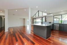  2 Filmer Pl Leeming WA 6149 $935,000 2 Filmer Place, LEEMING $935,000 FAMILY ENTERTAINER Open for Inspection:  Sat 4th Mar 1:30pm-2:15pm  Save    Creative and thoughtful design and a modern lifestyle blend to make this Leeming property feel like home. Set on a 727sqm corner block, the modern style of this 4/5 bedroom, 2 bathroom Webb and Brown-Neaves built home is instantly evident and draws you in wanting more. Upon entering the home you'll immediately be impressed by the wide entry hallway with stunning solid timber floors that extend throughout the open living. The home was well ahead of its time and has been cleverly designed into zoned living spaces, most with an outlook to the outdoor entertaining alfresco and swimming pool. The kitchen is central to the entertaining and living zones of the home so you'll always feel part of the action. It includes glass splash back, breakfast bench, a double fridge recess and modern appliances making it both attractive and functional. It is open plan to the dining area and lounge with impressive high raked ceiling creating a great feeling of space. The spacious tiled games room also has direct access to the outdoor bar and alfresco while the cosy theatre room with high raked ceiling is the perfect hideaway to watch a movie in peace.  Entertaining in this beautiful home is a delight. The timber decked alfresco and outdoor bar with stone bench top will be central to many gatherings and is all under the main roof, adding to the flowing feel of the home. The outdoor living overlooks the crystal blue swimming pool, complete with poured limestone surrounds and unobtrusive glass pool fencing. The roomy master suite features a generous walk-in robe and a timeless ensuite with large spa bath, double vanity, semi-frameless shower and separate toilet that all make this space your sanctuary. The 3 remaining bedrooms are located at the rear of the home and feature built-in robes and ceiling fans. The study or fifth bedroom is privately located at the front of the home.  The location is fantastic, only a short walk from Leeming high school and primary, the shops and cafes of Leeming Forum and parks and a short drive to Fiona Stanley hospital, Murdoch University, Bull Creek train station and freeway access. West Leeming and Bibra Lake primary school zones. It has all the extras including smart wiring, reverse-cycle air-conditioning, a double remote garage, security system, reticulation, large garden shed, freshly painted throughout, new additional lighting and great storage making organising life simple. Doesn't your family deserve the quality and lifestyle this beautiful home provides? Contact David Gooding for further details or viewing times. 