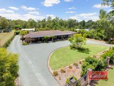  14 Sugar Gum Ct Jimboomba QLD 4280 $599,000 OMG – How Good Is This ! An outstanding opportunity to secure this substantial family home, surrounded by mature gardens, with the pool, the spacious outdoor entertainment area and an equally impressive shed already in place. With wide frontage and an electric gate at each end of the semi-circular driveway, your 1st impression will be a good one and it just keeps getting better, as you begin to see more of this well presented property. Large living spaces and ducted air-conditioning await your inspection, with the carpeted formal lounge set away from the rest, leading through to the spacious family room, with feature combustion heater in the corner, the dining area off and then on through twin 10 panel glass doors to the huge rumpus beyond. The hub of the home is the kitchen and once again it’s good news, with gas cooking, an electric oven and abundant high and low line cupboards, with heaps of bench space and a corner pantry included for good measure and the fridge space is excellent, enough for a matched fridge / freezer set. Bedrooms – more good news ! The master bedroom, set away from the rest is simply huge as you may be able to tell from our images. The next big surprise is the walk-in robe, which is also huge, so wardrobe space is unlikely to be an issue, and in keeping with everything else, the en-suite is also well appointed with both a corner Spa bath and a shower in this very spacious room. Bedroom 5 or the Study, is once again spacious and this theme continues through the other bedrooms, each of which has a large double built-in robe and ranges in size from large to extra-large. If you have been looking for a large family home with big bedrooms, then this is most definitely THE ONE ! Moving outside, you can all kick back and relax with your family and friends in the substantial outdoor entertainment area which also includes a built-in Bar and all of this is perfectly positioned, overlooking that sparkling (and I DO mean sparkling) in ground salt pool with cascade water feature, all of which combines to deliver a private and inviting outdoor entertaining experience with a genuine feel good factor. Moving beyond the pool and entertainment area, you’ll find a play area for the kids, before you reach the substantial shed, properly setup with its own safety switch and abundant power and lighting as you might expect. The mature gardens that I mentioned earlier have a real WOW Factor (which our photographer confirmed !) as you may be able to tell from our images, with a myriad of natives, fruit trees and shrubs delivering both privacy and interest, all of which have been established with low maintenance in mind; our owners appreciate the natural beauty that they created but did not want to be slaves to yard maintenance ! For those not familiar with the local area, Jimboomba Township is just a few minutes away, while Browns Plains is a 20 minute drive and Brisbane CBD is yours within the hour. The GOLD Coast too is similarly accessible and you’ll also find a wide range of sporting, recreational and educational facilities all close at hand. So if you have been searching in vain for that almost mythical large family home, on a stunningly beautiful block, with large living areas, big bedrooms, the pool, the outdoor entertainment area and the shed, then you really can’t afford to miss this one. An early inspection is MOST DEFINITELY recommended … Property Details Elders Property ID: 11181532 5 bedrooms 2 bathrooms 5 car parks Land Area 4353 square metres 5 car garage 