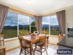  10 Junction Rd Mole Creek TAS 7304 $349,000-$369,000 A MUST SELL A tidier small-holding would be hard to find.  This smart three bedroom brick home sits proudly surrounded by over eight hectares of the most gorgeous country anywhere. The mountain scenery is magnificent, enveloping this gentle valley setting. Bordering the eastern boundary of this level property is a trout creek reserve with a pristine limestone stream meandering through farmland toward Mole Creek and, ultimately, the Mersey River. Inside you will find an open plan modern kitchen with picture-perfect Mount Roland views and integrating the dining and lounge areas, three bedrooms (two with built-ins), bathroom, separate W/C, plus laundry.  So many extras accompany this rural offering including 16 solar panels, 12mx7m lockable Colorbond double garage with workshop, 4-bay machinery shed, garden and wood sheds as well as chook run. A small mixed orchard graces one side of the circular driveway. Water is abundant and includes rainwater tanks as well as an inexpensive communal creek water system for gardens and toilet. Very good fencing surround paddocks, lending them to animals, cropping, orchard, or small fruit production. Only 80km to Cradle Mountain National Park and conveniently serviced by the nearby Mole Creek township for fuel, PO, groceries and more, this perfect lifestyle property is located less than an hour from Launceston. General Features Property Type: House Bedrooms: 3 Bathrooms: 1 Land Size: 7.97 Hectares 