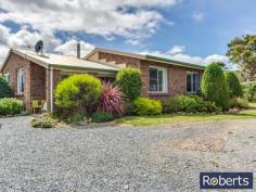  10 Junction Rd Mole Creek TAS 7304 $349,000-$369,000 A MUST SELL A tidier small-holding would be hard to find.  This smart three bedroom brick home sits proudly surrounded by over eight hectares of the most gorgeous country anywhere. The mountain scenery is magnificent, enveloping this gentle valley setting. Bordering the eastern boundary of this level property is a trout creek reserve with a pristine limestone stream meandering through farmland toward Mole Creek and, ultimately, the Mersey River. Inside you will find an open plan modern kitchen with picture-perfect Mount Roland views and integrating the dining and lounge areas, three bedrooms (two with built-ins), bathroom, separate W/C, plus laundry.  So many extras accompany this rural offering including 16 solar panels, 12mx7m lockable Colorbond double garage with workshop, 4-bay machinery shed, garden and wood sheds as well as chook run. A small mixed orchard graces one side of the circular driveway. Water is abundant and includes rainwater tanks as well as an inexpensive communal creek water system for gardens and toilet. Very good fencing surround paddocks, lending them to animals, cropping, orchard, or small fruit production. Only 80km to Cradle Mountain National Park and conveniently serviced by the nearby Mole Creek township for fuel, PO, groceries and more, this perfect lifestyle property is located less than an hour from Launceston. General Features Property Type: House Bedrooms: 3 Bathrooms: 1 Land Size: 7.97 Hectares 