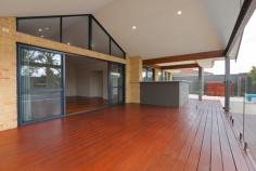  2 Filmer Pl Leeming WA 6149 $935,000 2 Filmer Place, LEEMING $935,000 FAMILY ENTERTAINER Open for Inspection:  Sat 4th Mar 1:30pm-2:15pm  Save    Creative and thoughtful design and a modern lifestyle blend to make this Leeming property feel like home. Set on a 727sqm corner block, the modern style of this 4/5 bedroom, 2 bathroom Webb and Brown-Neaves built home is instantly evident and draws you in wanting more. Upon entering the home you'll immediately be impressed by the wide entry hallway with stunning solid timber floors that extend throughout the open living. The home was well ahead of its time and has been cleverly designed into zoned living spaces, most with an outlook to the outdoor entertaining alfresco and swimming pool. The kitchen is central to the entertaining and living zones of the home so you'll always feel part of the action. It includes glass splash back, breakfast bench, a double fridge recess and modern appliances making it both attractive and functional. It is open plan to the dining area and lounge with impressive high raked ceiling creating a great feeling of space. The spacious tiled games room also has direct access to the outdoor bar and alfresco while the cosy theatre room with high raked ceiling is the perfect hideaway to watch a movie in peace.  Entertaining in this beautiful home is a delight. The timber decked alfresco and outdoor bar with stone bench top will be central to many gatherings and is all under the main roof, adding to the flowing feel of the home. The outdoor living overlooks the crystal blue swimming pool, complete with poured limestone surrounds and unobtrusive glass pool fencing. The roomy master suite features a generous walk-in robe and a timeless ensuite with large spa bath, double vanity, semi-frameless shower and separate toilet that all make this space your sanctuary. The 3 remaining bedrooms are located at the rear of the home and feature built-in robes and ceiling fans. The study or fifth bedroom is privately located at the front of the home.  The location is fantastic, only a short walk from Leeming high school and primary, the shops and cafes of Leeming Forum and parks and a short drive to Fiona Stanley hospital, Murdoch University, Bull Creek train station and freeway access. West Leeming and Bibra Lake primary school zones. It has all the extras including smart wiring, reverse-cycle air-conditioning, a double remote garage, security system, reticulation, large garden shed, freshly painted throughout, new additional lighting and great storage making organising life simple. Doesn't your family deserve the quality and lifestyle this beautiful home provides? Contact David Gooding for further details or viewing times. 