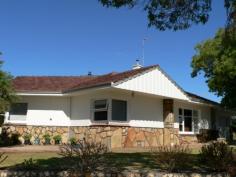  70 Blantyre St Katanning WA 6317 $285,000 Caulfield House House - Property ID: 914006 Lovely character home in central location close to shops and other amenities. Set on a medium-sized block, it has 3 spacious bedrooms with large built in robe in master bedroom. Lounge has feature ceiling, stone fire place and bamboo flooring. Lovely kitchen/dining room has original parketry floor, new ceramic cook top, electric oven and stainless steel range hood.  Family room with wood fire keeps house cosy in winter. Central walk in store room. New laundry and toilet. Security screen doors back and front. Also lock up garage with electric roller door plus carport. Established easy care gardens with shady trees. Quality fitting throughout.  Features  Land Size Approx. - 930 m2  Built-In Wardrobes  Close to Schools  Close to Shops  Close to Transport  Fireplace(s) 