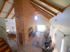  42 Delaneys Rd Cowra NSW 2794 $695,000 One of a Kind! You will enjoy exploring this absolutely unique home and surrounds sitting on top of Abbey Ridge looking out over Cowra. Abby Ridge is an amazing one of a kind home on 7.8Ha (19.5 Acres) created to be easily maintained for lovers of entertaining,, retirees to enjoy the space or to delight large families. Every day you will be able to experience the joy of living in a rural landscape. Picture's do tell a story and so does the long list of features incorporated into this home. 5 Spacious bedrooms; 	 Ensuite; Huge 3 way bathroom;  Beamed cathedral ceilings; Expansive open plan living; Huge Country kitchen with dishwasher; Hydronic in floor heating (heat pump) Ducted reverse cycle A/C (thermal air) Stairs to mezzanine level; His and hers offices; Mezzanine loft with bedroom;  Surrounded by verandahs; Outside WC; Huge brick 7m x 7m garage with panel lift doors; 9m x 7m Colorbond workshop; Ample Water from bore,  reticulated through auto water system to gardens; 80,000 Lt Rain water  7.8 Hectares (19.5 Acres) 5kw solar power Orchard & Vineyard; Fantastic outdoor living area; His and hers offices; Upstairs bathroom & Vanity Warm open fire place Call Today To inspect this one of a kind property 