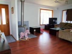  5 Pearse Street Singleton NSW 2330 $375,000 Jerrys Plains - 1.49 Acre Lifestyle Property This neatly presented 3 bedroom home is situated on approximately 6069 sqm (1.49 acres set over 3 titles) and features:  * Floating timber floors, combustion fireplace, reverse cycle air conditioner. * Separate lounge & dining areas, laminate kitchen with good sized pantry.  * Built in robes & ceiling fans to all bedrooms. * 9m x 5m covered deck, 3 bay lockable shed, fully fenced paddock. * Town water, 5000 gallon water tank, well with pump.  This property has a lovely outlook and is located approximately 25 minutes from Singleton & Muswellbrook 