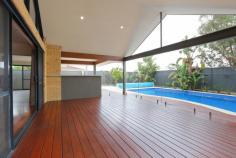  2 Filmer Pl Leeming WA 6149 $935,000 2 Filmer Place, LEEMING $935,000 FAMILY ENTERTAINER Open for Inspection:  Sat 4th Mar 1:30pm-2:15pm  Save    Creative and thoughtful design and a modern lifestyle blend to make this Leeming property feel like home. Set on a 727sqm corner block, the modern style of this 4/5 bedroom, 2 bathroom Webb and Brown-Neaves built home is instantly evident and draws you in wanting more. Upon entering the home you'll immediately be impressed by the wide entry hallway with stunning solid timber floors that extend throughout the open living. The home was well ahead of its time and has been cleverly designed into zoned living spaces, most with an outlook to the outdoor entertaining alfresco and swimming pool. The kitchen is central to the entertaining and living zones of the home so you'll always feel part of the action. It includes glass splash back, breakfast bench, a double fridge recess and modern appliances making it both attractive and functional. It is open plan to the dining area and lounge with impressive high raked ceiling creating a great feeling of space. The spacious tiled games room also has direct access to the outdoor bar and alfresco while the cosy theatre room with high raked ceiling is the perfect hideaway to watch a movie in peace.  Entertaining in this beautiful home is a delight. The timber decked alfresco and outdoor bar with stone bench top will be central to many gatherings and is all under the main roof, adding to the flowing feel of the home. The outdoor living overlooks the crystal blue swimming pool, complete with poured limestone surrounds and unobtrusive glass pool fencing. The roomy master suite features a generous walk-in robe and a timeless ensuite with large spa bath, double vanity, semi-frameless shower and separate toilet that all make this space your sanctuary. The 3 remaining bedrooms are located at the rear of the home and feature built-in robes and ceiling fans. The study or fifth bedroom is privately located at the front of the home.  The location is fantastic, only a short walk from Leeming high school and primary, the shops and cafes of Leeming Forum and parks and a short drive to Fiona Stanley hospital, Murdoch University, Bull Creek train station and freeway access. West Leeming and Bibra Lake primary school zones. It has all the extras including smart wiring, reverse-cycle air-conditioning, a double remote garage, security system, reticulation, large garden shed, freshly painted throughout, new additional lighting and great storage making organising life simple. Doesn't your family deserve the quality and lifestyle this beautiful home provides? Contact David Gooding for further details or viewing times. 