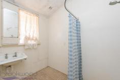  32 Lobelia Ave, Wundowie WA 6560 One look at the incredibly affordable price tag of this 1,012sqm elevated property and you will know two things: 1) that you’re looking at an unparalleled bargain, and 2) some work will be required to bring this simple three bedroom one bathroom home back to it’s former glory. Set above the road it has loads of potential, a simple floorplan, Jarrah floorboards, high ceilings, a rear patio and large shed and plenty of room to grow. Elevated outlook over town 3 bedrooms 1 bathroom 1965 fibro & tile cottage Simple kitchen & bathroom Cosy lounge with s/c fire Jarrah f/boards, high ceilings Lrg laundry, rear party patio 6x6m shed/ double garage  High set 1,012sqm block Walk to shops, school, oval What you see is what you get with this humble abode. It has three bedrooms, a bathroom, large laundry with separate toilet, a cosy lounge with slow combustion fire and an original kitchen/meals area. Sitting high on the block, its elevated outlook across town through the front windows increases the feeling of space. Sit out the back on the brick patio or potter in the 6x6m shed and contemplate what you could do with this property. It’s yours for the making. Wundowie is one of the first true country towns on the eastern fringe of the metropolitan area and as such contains all the essential services needed for a self-supporting community, including a police station, medical centre, ambulance station, fire brigade, community centre, library, post office, day care, fantastic sporting facilities and more. Wundowie Primary School is an attractive landmark in the town whose streets are laid out in an amphitheatre-style arrangement. This elevated 1,012sqm block is in easy walking distance to the shops and medical centre. All of Wundowie is on your doorstep and it’s incredibly affordable. So if you’re looking to get started with your own home or you’re looking for an straightforward investment, don’t ignore this great opportunity. To arrange an inspection of this property or for friendly and honest assistance with any of your real estate needs call Mr Happy - Ross Webster - 0407 387 004. BE SEEN - BE SOLD - BE HAPPY Do you want your property sold? For professional photography, local knowledge, approachable staff, a proven sales history and quality service at no extra cost call the Brookwood Team. 