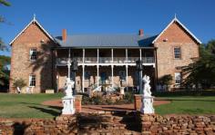  24 Grey St, York WA 6302 Faversham House is considered one of the most beautiful properties in Western Australia and is one of Australia’s oldest privately owned country homes. The residence sits at the end of a gated drive and is set on 1.7 hectares of spectacular heritage parkland gardens and vineyards overlooking Mt Brown. Established by the Monger family in 1840 the property has a fascinating history which includes being gifted to the Australian Government to assist with the war effort in 1941. The house was then used by the Red Cross as a hospital until the 1950’s. The earliest parts of Faversham House date from 1840, and early renovations include a spacious drawing room with fireplace and a sizeable dining hall. It has been in the hands of the current owners since 2004 and boasts interiors restored with Georgian and Victorian features. The gardens have undergone considerable landscaping and feature additions such as the “secret garden and amphitheatre”. With its elegant romantic setting this impressive heritage mansion currently operates as a country house wedding venue, as well as a unique location for corporate functions, which the current owners say generate “good income”. It has hosted over 150 weddings during the past 10 years, as well as many conferences and company meetings for national corporations, government departments and universities, many of which are repeat bookings. 14 bedrooms all with air conditioning, 7 of which are located on the top floor and are extremely spacious accommodating both a kingsize bed and sitting area. Six further bedrooms are set around a pretty courtyard with pergola adjacent to the main building. Two of these have been superbly upgraded in recent years. – Spacious front balcony with fabulous views. – Impressive grounds covering over 5 acres, including established gardens, mature trees, fruit trees and expansive lawns. – Peace and tranquillity whilst still being within walking distance of town. – Listed with the National Trust and registered on the National Estate of the Australian Heritage Commission. – Permission for private residence, private with income or commercial (function centre, B&B, art gallery, restaurant etc). The house is perfect as an idyllic private residence, however the unique setting is ideal for private functions such as company seminars, boutique accommodation or a wedding venue. Situated in the heart of York with an easy walk to the nearby historic attractions and restaurants in town. 75 minutes drive from Perth. 