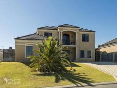  4 Rainham Ave, Mindarie WA 6030 This beautifully presented contemporary home is the perfect combination of relaxed family living and home entertaining. Built over two levels, the home has many fine features including spacious bedrooms, reverse cycle air conditioning, multiple living rooms, gourmet kitchen, spacious alfresco entertaining area and swimming pool. Ground floor features include: -Home office or study  -Open plan living and dining room  -Separate lounge and formal dining room -Home theatre room -Gourmet kitchen with dishwasher, large pantry and stone benchtops -Laundry with drying court -Separate powder room -Alfresco entertaining area with low maintenance lawns and gardens -Swimming pool with secure glass pool fencing First floor features include: -Balcony with stunning ocean views -Master bedroom with walk in robe and ensuite bathroom  -Guest bedroom with built in robe and direct access to family bathroom -Two additional double bedrooms both with robes -Family bathroom with bath and shower -Separate powder room Additional features include: -Reverse cycle air conditioning -Ceiling fans -Balcony with stunning ocean views -Fully secured double garage with generous off street visitor parking Located within 1km of Mindarie Keys, close to Ocean Keys shopping centre and Mindarie Primary School. For an immediate viewing please contact Lisa Joyce 0419 648 634. 