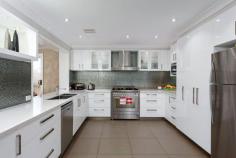  80 Veale St, Ashmont NSW 2650 - This home is sure to impress the minute you walk in the door - Tastefully renovated throughout - Not a cent has been spared  - Featuring five double sized bedrooms with built-in robes and ceiling fans - Master bedroom with walk-in robe and stunning renovated ensuite - Separate children's retreat upstairs ensures enjoyment for the whole family - Main bathroom has been beautifully renovated plus a third toilet downstairs - Formal lounge/dining, theatre room and large separate rumpus room - Amazing kitchen with marble bench tops, generous breakfast bar,  stainless steel appliances and plenty of storage. - Large outdoor undercover entertainment area with spa and sauna  - Large double garage, an additional 2 bay shed - Perfect for the Tradesman - Garden shed plus high double carport which is ideal for boats and caravans - Other features include, security system, ducted heating and cooling - Immaculately presented - The friends and family will not be disappointed *All information contained herein is gathered from sources we believe to be reliable, however, we cannot guarantee its accuracy and interested persons should rely on their own enquiries. 