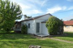  10 Aplin Street Stanthorpe QLD 4380 Easy stroll to Stanthorpe's main street, schools, shop etc - all town services ---set on generous 1012m2 land - low set timber home with 2 bedrooms + sleep out, separate lounge with gas heater, good size dining/kitchen area - there is a combustion stove PLUS electric stove and plenty of good cupboard space too! The bathroom has a separate toilet. There is a covered casual area at the rear - ideal for all year use and more space! The property also has a single lock up garage plus garden shed. Currently there is an excellent long term tenant on a month to month lease but happy to continue if suits an investor! Rental is $210 per week. Great buy on today's market to live in or as investment and a keen seller wants this sold now! So what are you waiting for? Call Anne Lindsay on 0418 737309. Features Smoke Alarms Undercover outdoor area Safety Switch 