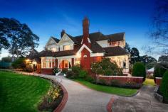  5 Willsmere Rd, Kew VIC 3101 Federation magnificence with sweeping vistas   Featured in Home & Garden Beautiful in August 1913, Harelands is an exquisite Federation residence which majestically displays its glorious period features both inside and out.  Rich Arts and Crafts oak panelling, bay windows, superb leadlighting, and elegant open fireplaces reveal themselves as you step into the regal reception hall. Leading one way, the beautiful drawing room and breathtaking dining room with inglenook and soaring oak panelled ceiling flow out to a verandah where you can soak up the sunshine and drink in the attractive landscaped garden views.  Infinitely flexible, an array of ground floor bedrooms, sitting rooms and studies total 7 rooms, accompanied by 2 bathrooms. A sweeping staircase leads up to 4 bedrooms and 2 newly renovated bathrooms, fitted with Brodware and Franke tapware, extensive granite and a spa. Marvel in the spectacular view out to the blue hills of the Northern Ranges from the massive master bedroom, lined in oak.  The lower level reveals a sublime granite and timber kitchen with 4-oven AGA and Windsor commercial stove, commercial rangehood, Miele dishwasher, butler's and walk-in pantry. The huge rumpus room, temperature controlled wine cellar and utility rooms ensure that every family need has been catered for.  Boasts a separate and renovated 2 bedroom cottage with lounge/dining, modern kitchen, bathroom, heating and cooling, plus an original 1 bedroom unit, and a 3 car garage behind high, secure fencing and auto gates.  A very long list of premium features includes double glazed windows, ducted heating and cooling, rewired with 3-phase power, full cabling, monitored alarm, intercom and external security lighting.  Perfect for families, stroll to many of Melbourne's finest private schools, High Street trams, restaurants and boutiques, with the freeway close by.   STRICTLY PRE REGISTERED BUYERS ONLY 