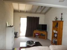  3/61 South Station Road, Booval QLD 4304 Walking distance to the train, buses across the road, all equal convenience. The two bedrooms are a great size with the Master having an air conditioner. Both bedrooms are carpeted with fans and built in cupboards. Exposed beams in the carpeted lounge room and a fan. Storage is sorted with 2 linen cupboards. Single lock up garage. Kitchen is functional with double door pantry cupboard. Rental return $250 a week. Phone to book private viewing. 
