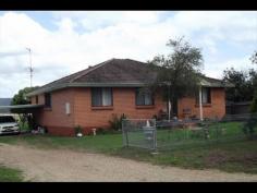  22 Goulburn Dr, Sandy Hollow NSW 2333 3-4 Bedroom Brick Veneer on 1.5Acres Solid 3-4 bedroom brick veneer home in the scenic village of Sandy Hollow overlooking farmland , set on a large lot of 1.5Acr or 6165mrs in size , Home has loads of potential set with large open living area with wood heating and polished floors, kitchen. Three bedrooms 2 with BIWs, formal lounge room or 4th Bedroom. Tiled bathroom, huge rear family room, laundry with 2nd bathroom. Attached double carport, subdivision potential or room to enjoy with space for a Pony. 