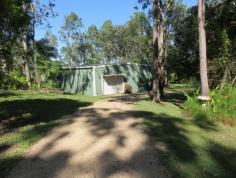  LOT 24 MOUNTNEY ROAD Strathdickie Qld 4800 BEAUTIFULLY LANDSCAPED ACREAGE WITH HUGE SHED & WEEKENDERPRIVACY AND BEAUTY This beautifully landscaped 6.5 acre property has a huge shed with an adjoining weekender overlooking beautiful gardens and neighbours dam. As you walk among the manicured lawns you are taken back to a place of peace and tranquility.The property is 3/4 fenced with tank and bore water and is slightly undulating. Come and inspect this property and you will fall in love with it with its privacy and beauty.  Strathdickie is a short drive to Airlie Beach and Cannonvale with all major shopping, doctors, marinas, pools, beaches. The Gateway to The Great Barrier Reef Call the agent now for your private inspection 