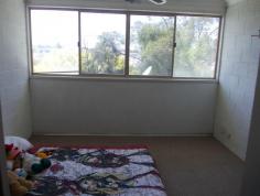  3/61 South Station Road, Booval QLD 4304 Walking distance to the train, buses across the road, all equal convenience. The two bedrooms are a great size with the Master having an air conditioner. Both bedrooms are carpeted with fans and built in cupboards. Exposed beams in the carpeted lounge room and a fan. Storage is sorted with 2 linen cupboards. Single lock up garage. Kitchen is functional with double door pantry cupboard. Rental return $250 a week. Phone to book private viewing. 
