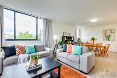  U 111/100 Giles Street, Kingston, ACT 2604 Enjoy the lifestyle at this two-bedroom, top floor, corner apartment, with all that Kingston Foreshore and Kingston has to offer - with vibrant cafes, shops and Lake Burley Griffin just a stroll away.  For work, it's only a short distance to the Parliamentary Triangle, Barton and Manuka. This apartment would appeal to those wanting to live in or invest. Tucked away from the living area are two good-sized bedrooms, ensuite, built-in robes and a second bathroom with bath. The entry hallway has the laundry closet and a nook area and leads to the spacious open plan living and kitchen area.  Gas cook top and stone benches complete this modern kitchen.  The balcony extends that feeling of space. Car accommodation is a tandem arrangement for two cars in an underground parking area for security and convenience.  Secure entry via intercom system Main bedroom with ensuite and built-in robe Bedroom two with built-in robe Open plan living area opening to balcony Kitchen with stone bench tops, dishwasher, gas and electric cooking European style laundry with dryer Windows are double glazed Internet connectivity Reverse cycle air conditioner Nook Secure car parking for two cars Bus stops along Wentworth Avenue Communal BBQ in complex Property features Dishwasher Reverse Cycle Heating and Cooling Built-ins 
