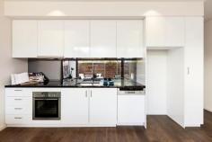  109/102 Rankins Road Kensington VIC 3031 Epitomising the ultimate in modern design and quality, this executive, as new one bedroom plus study residence within “The London” boutique apartment complex is ideally located on a picturesque tree-lined street, close to Kensington train station, Macaulay Road shopping and cafe precinct and just 4km from the CBD. Generous open plan living spills onto a large, full-width entertaining balcony via broad glass bi-fold doors, seamlessly and fashionably bringing the outdoors in. Coupled with the gourmet kitchen boasting stone bench tops, smoked glass mirrored splashbacks, soft close drawers, state-of-the-art Neff stainless steel appliances including induction cooktop and semi-integrated dishwasher, entertaining is nothing short of a dream. From the frosted glass sliding door separating the master bedroom and ensuite to the exclusive chrome fixtures, stone bench vanity and mirrored wall, the fully tiled bathroom is a statement in contemporary style. Video intercom entry and complex surveillance provide peace of mind for the security conscious, whilst split system air-conditioning ensures year round comfort. Other impressive features include secure parking bay, well-designed study nook, polished timber floorboards, storage cage, European laundry and sheer roller blinds. In a class of its own, “The London” will exceed your expectations and deliver the ultimate urban lifestyle. Features - Chic apartment featuring quality fixtures and finishes throughout - Spacious open plan living with huge private entertaining balcony - Fabulous stone bench kitchen with state-of-the-art stainless steel Neff appliances - Good sized bedroom with vogue ensuite bathroom, BIRs plus study nook - Split system air conditioning, quality flooring and great storage - Video intercom entry and undercover parking plus complex surveillance 